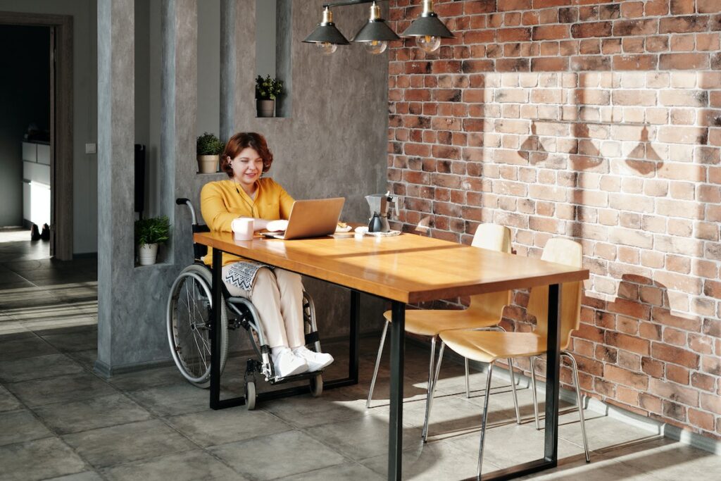 Workplace Safety: woman-sitting-on-wheelchair-while-using-laptop
